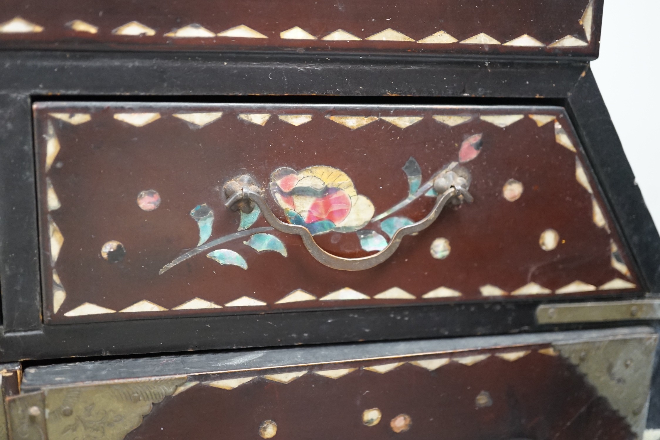 A Japanese inlaid mother-of-pearl miniature chest. 36cm tall